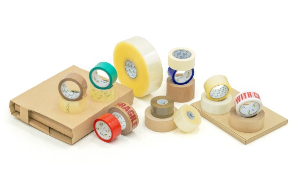 A collection of various tape types and cardboard boxes arranged on a white background.